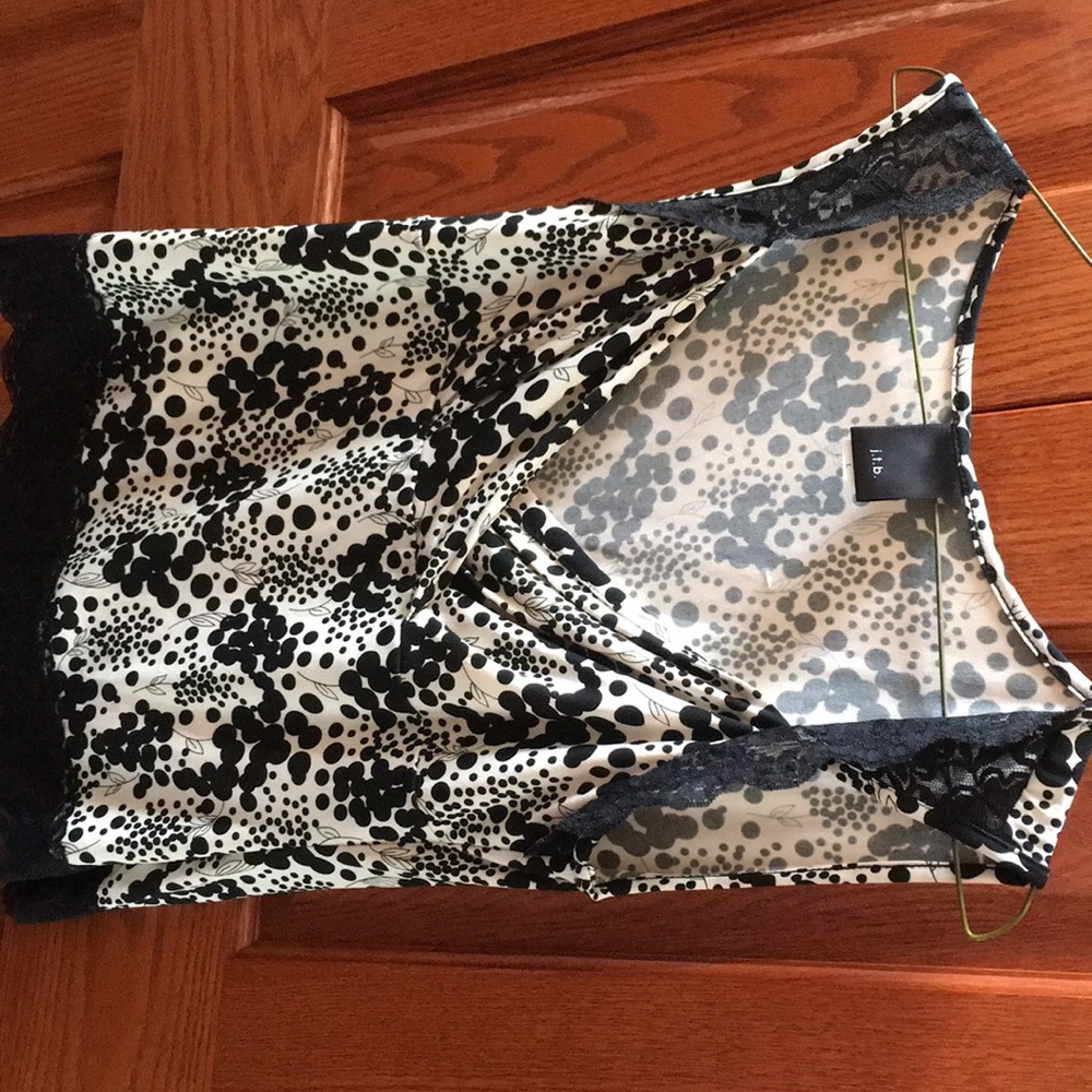 Black and white shirt. Trimmed in black lace.
